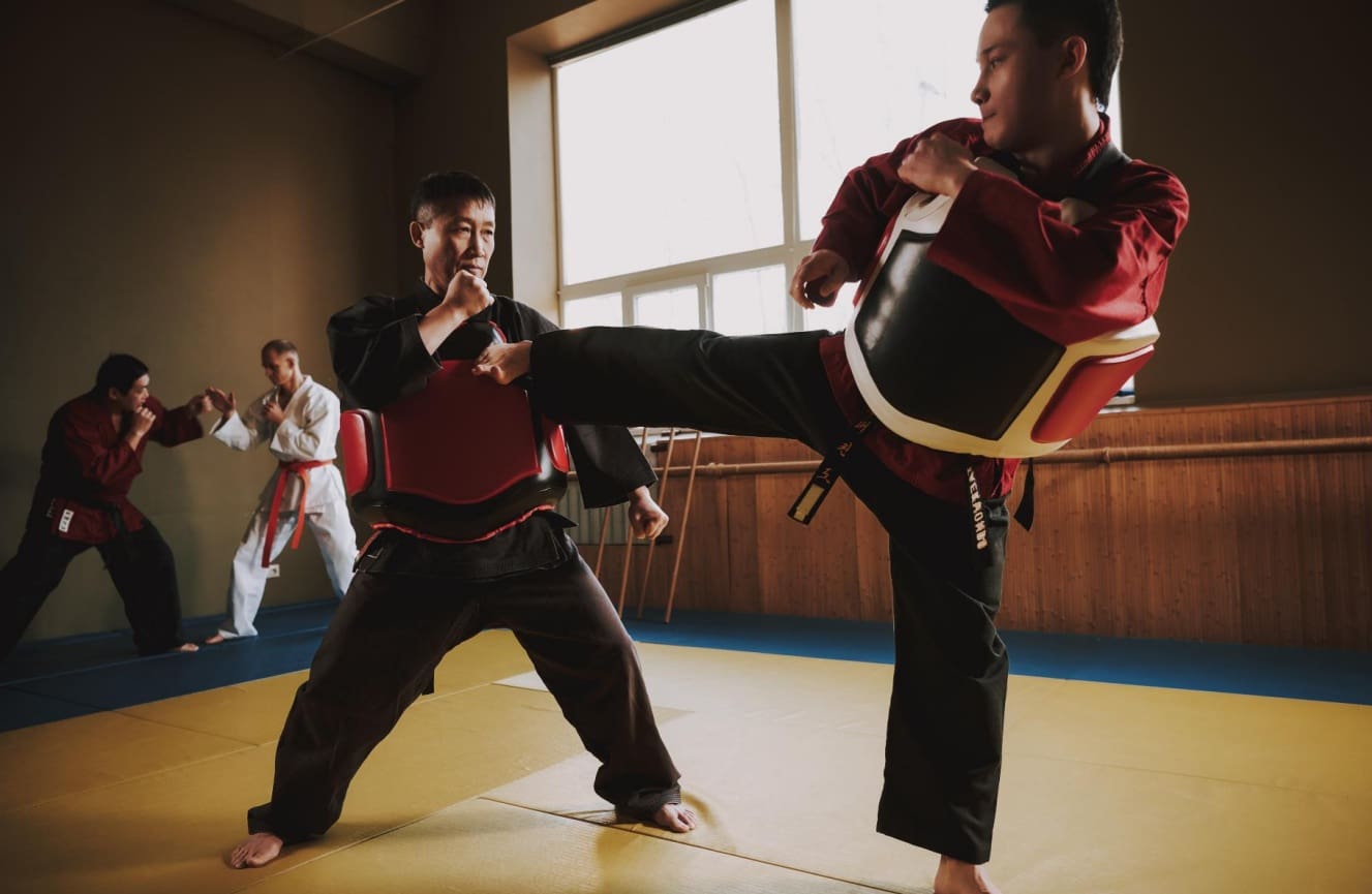 Adult martial arts programs provide structured physical activity that boosts self-esteem, improves flexibility, lowers blood pressure, and builds self-discipline and endurance through expert instructor-led training.